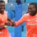 Ephron Mason-Clark (left) and Brandon Thomas-Asante (right), both wearing Coventry City's bright orange away strip, give each other five while celebrating a goal at Sheffield Wednesday in October