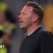 Wales boss Craig Bellamy reacts with an open-mouthed expression as he stands in a round-neck black top