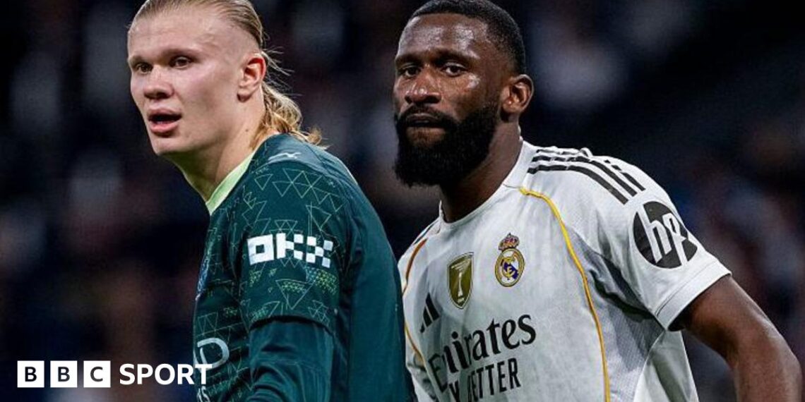 Manchester City striker Erling Haaland stands next to Real Madrid defender Antonio Rudiger during the Uefa Champions League match between the two teams at the Estadio Santiago Bernabeu