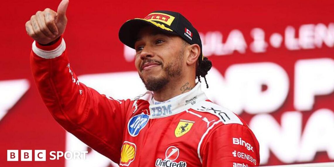 Lewis Hamilton gives a thumbs up on the podium in Canada
