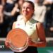 Maja Chwalinska smiles while holding the French Open women's singles runner-up trophy