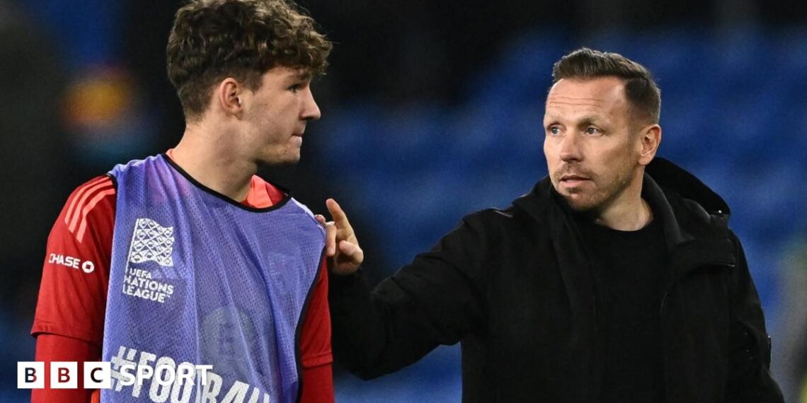Lewis Koumas with Wales boss Craig Bellamy