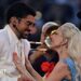 Bad Bunny and Lady Gaga smiling at each other as they perform the half-time show at Super Bowl 60