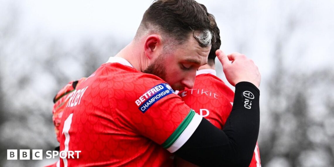 Joe Baldwin and Lloyd Roby of North Wales Crusaders embrace