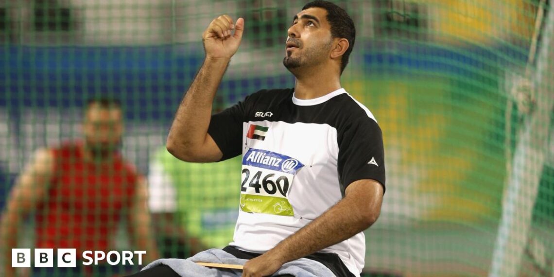 Abdullah Hayayei warming up in a shot put cage