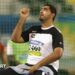 Abdullah Hayayei warming up in a shot put cage