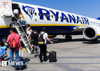 Ryanair investigated over charging parents to sit with children