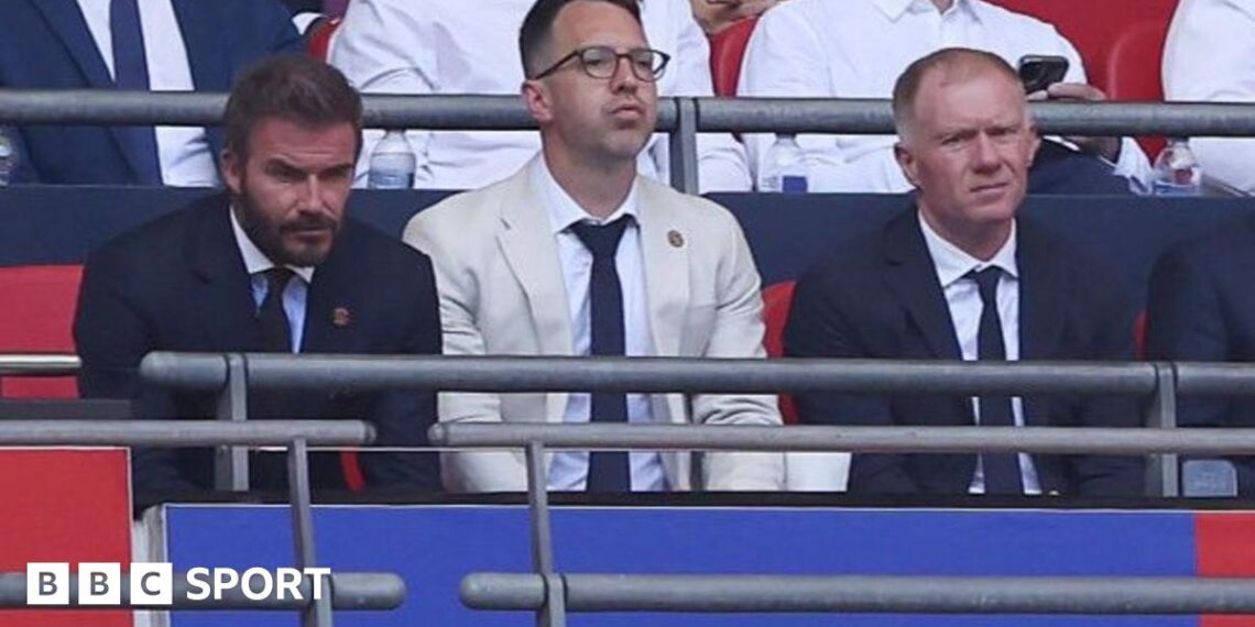Salford co-owner David Beckham (left) and football director Paul Scholes sit either side of chief executive Gavin Fleig at Wembley