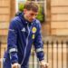 Scotland's Billy Gilmour leaves the team hotel on crutches