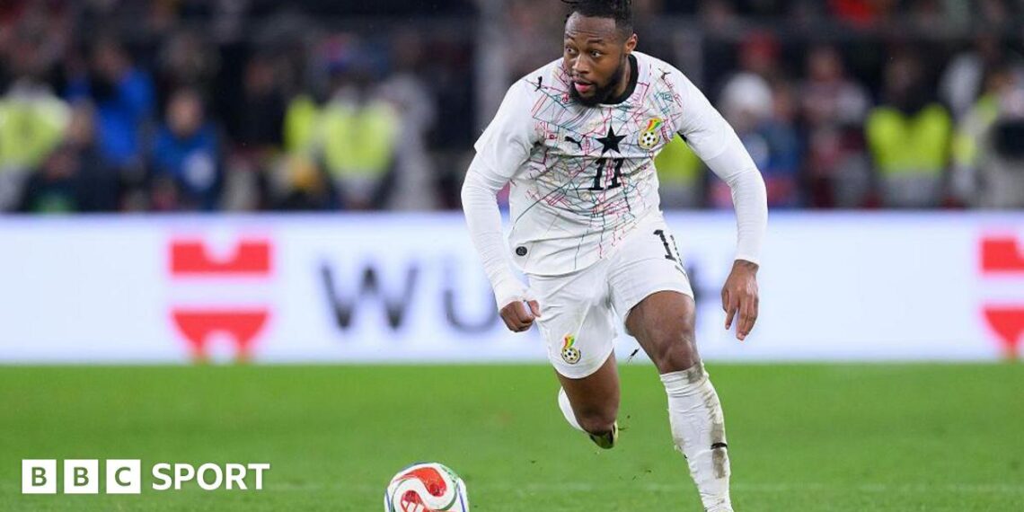 Antoine Semenyo runs with the ball in a white Ghana strip