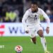Antoine Semenyo runs with the ball in a white Ghana strip