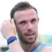 Jordan Henderson mops his brow during an England training session
