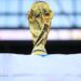 A World Cup trophy is perched on top of a Scotland flag.