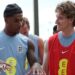 Marcus Rashford and Anthony Gordon of England interact as they walk out for a training session